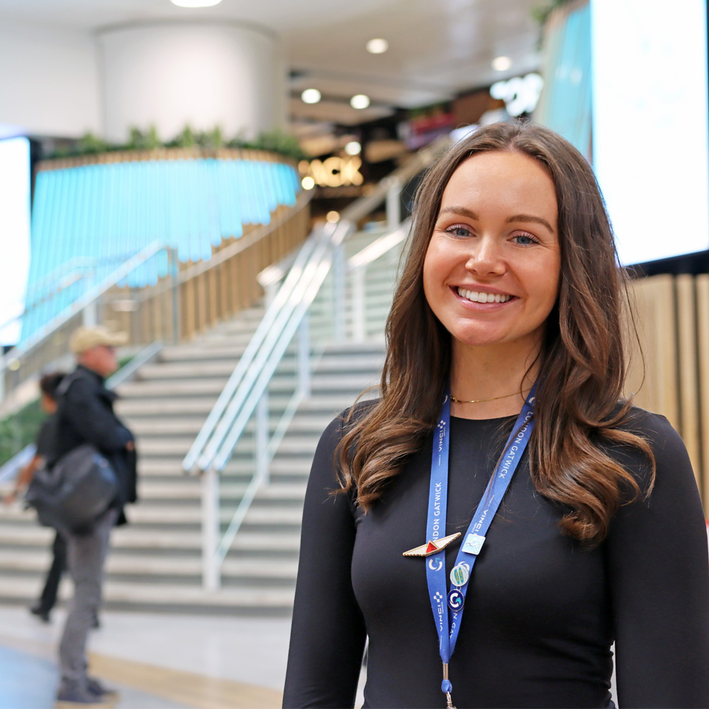 Amber, the commercial graduate, stood in the newly refurbished North Terminal departure lounge, with restaurants behind her