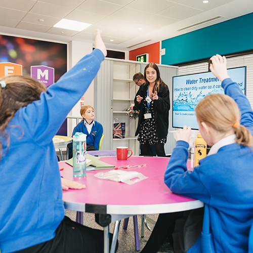 A photo of a London Gatwick colleague giving a speech to schoolchildren